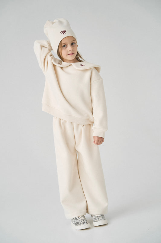 Dres kremowy z kokardkami