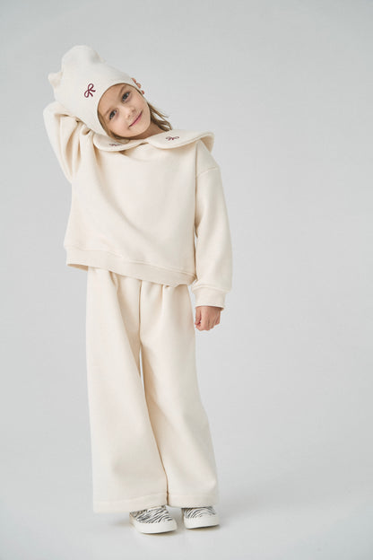 Dres kremowy z kokardkami