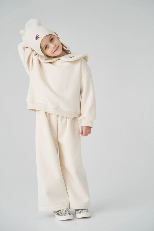 Dres kremowy z kokardkami